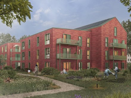 Visualisierung eines Wohnquartiers mit roten Holzgebäuden, Balkonen und begrünten Freiräumen.