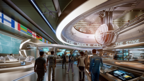Futuristische Ausstellungshalle mit mehreren Ebenen, digitalen Anzeigen und Besuchergruppen. Internationale Flaggen verlaufen entlang der Decke, Rolltreppen führen in obere Bereiche.