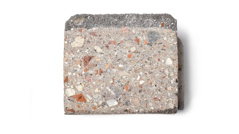 Betonprobe mit sichtbaren Gesteinskörnungen in verschiedenen Farben und Formen