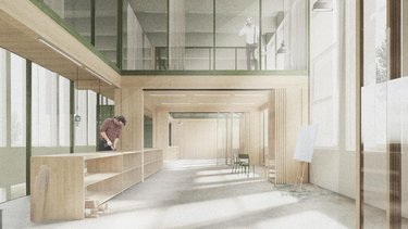 Innenraum einer offenen Werkstatt mit Holzstruktur und Tageslicht.