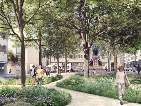 Schmaler gepflasterter Fußweg mit rotem Ziegelbelag entlang eines flachen Wasserlaufs. Hohe Bäume säumen beide Seiten. Paare joggen/gehen auf dem Weg. Historische Steinmauern und Gebäudetürme sichtbar. Grüne Vegetation und Wiese.