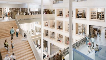 Offene Bibliothek mit Treppen, Galerien und vielen Menschen zwischen Bücherregalen und Lesebereichen.