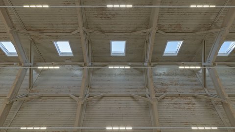 Detailansicht der Hallendecke mit Holzbalken und Oberlichtern