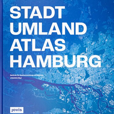 Der „Stadt Umland Atlas Hamburg“ liegt auf ausgebreiteten Karten.
