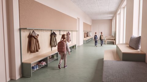Flur einer Grundschule mit Garderoben, Sitzbank und drei Kindern mit Rucksäcken