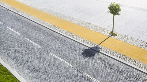 „Draufsicht auf eine gepflasterte Straße mit gestrichelten weißen Markierungen. Daneben verlaufen ein gelber Weg und ein breiter, hell gepflasterter Platz. Ein junger Baum wirft seinen Schatten über Straße und Weg.“
